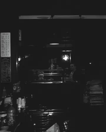 AI image, week 2: a very dark bakery.